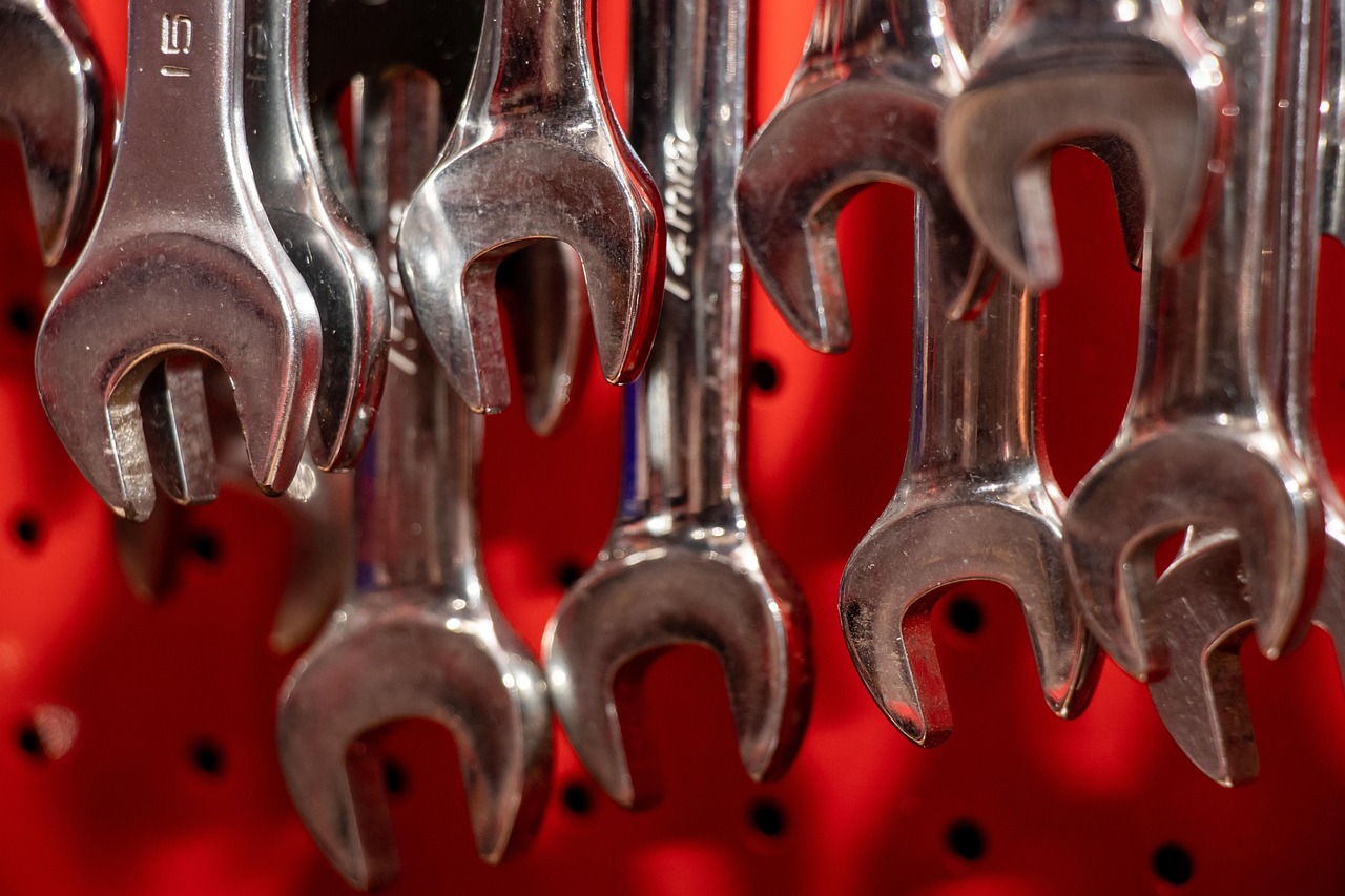 Wrenches on a tool board, standing in for ongoing website upkeep