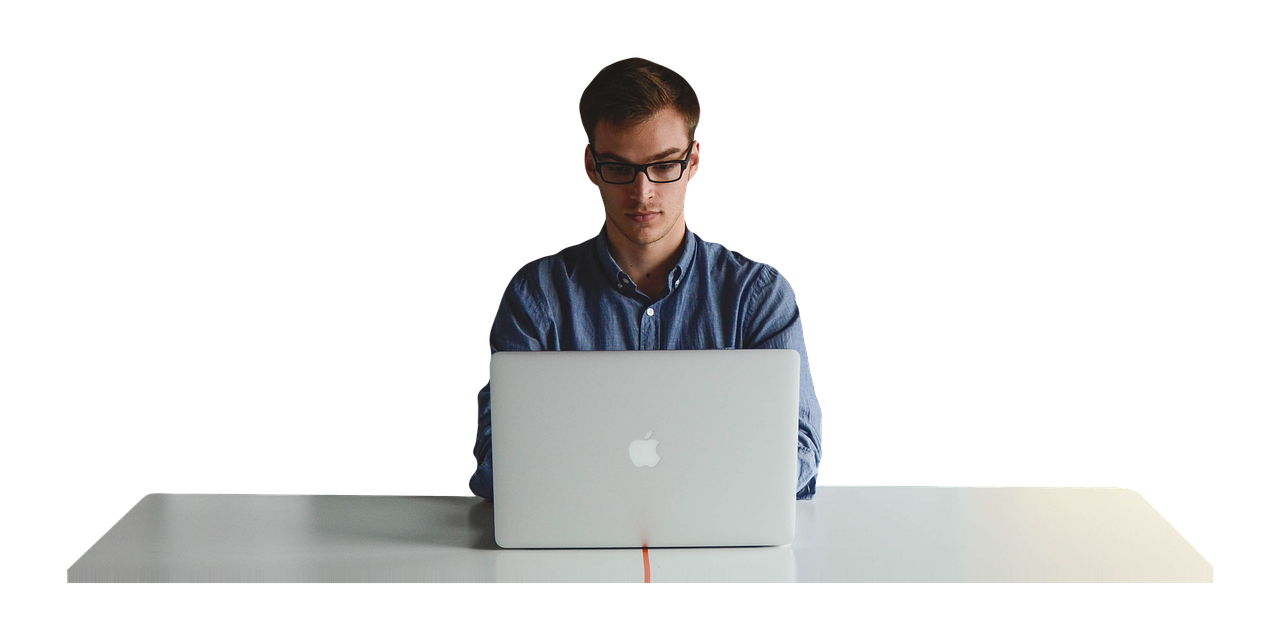 Person working on a laptop while reviewing a business website